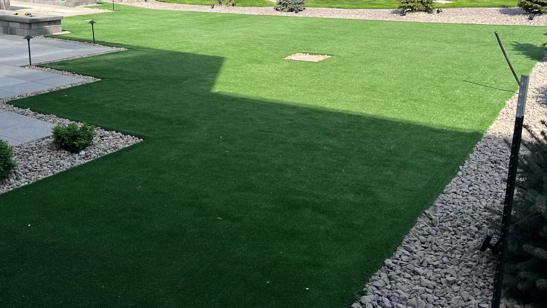 A vibrant green artificial lawn installed by our team for a client in Papillion, NE.